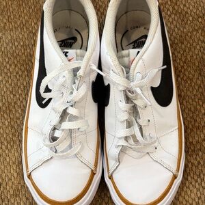 Nike White and Black Sneakers with Gold Trim